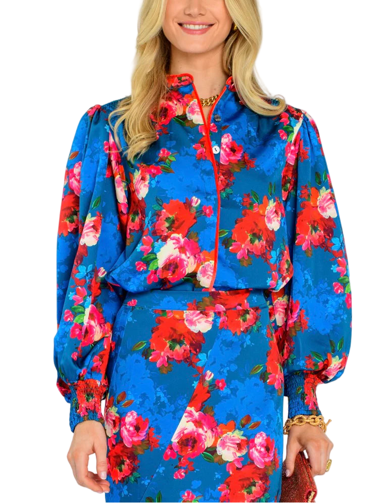 The Emily Top is the perfect button front blouse, featuring a mandarin collar, covered placket, and balloon sleeves. This season, she is cut from a light satin fabric in our Holiday Chintz Teal print, great for dressing up or down this season.