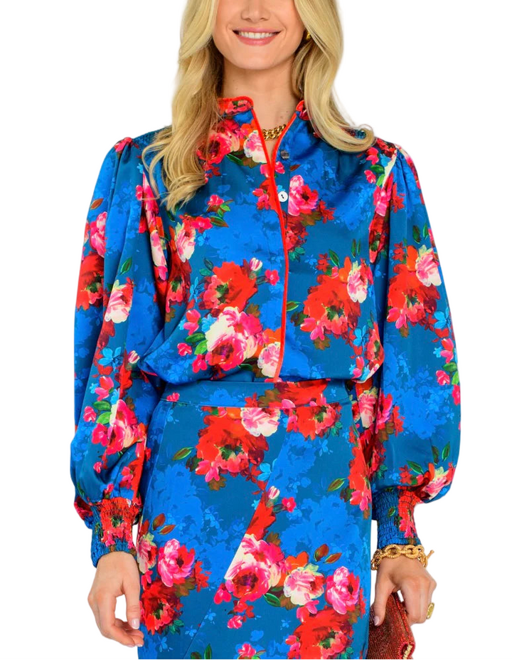 The Emily Top is the perfect button front blouse, featuring a mandarin collar, covered placket, and balloon sleeves. This season, she is cut from a light satin fabric in our Holiday Chintz Teal print, great for dressing up or down this season.