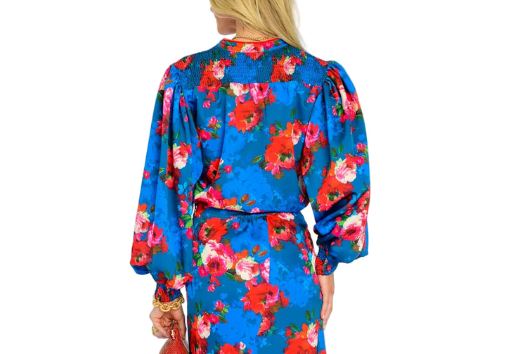 The Emily Top is the perfect button front blouse, featuring a mandarin collar, covered placket, and balloon sleeves. This season, she is cut from a light satin fabric in our Holiday Chintz Teal print, great for dressing up or down this season.