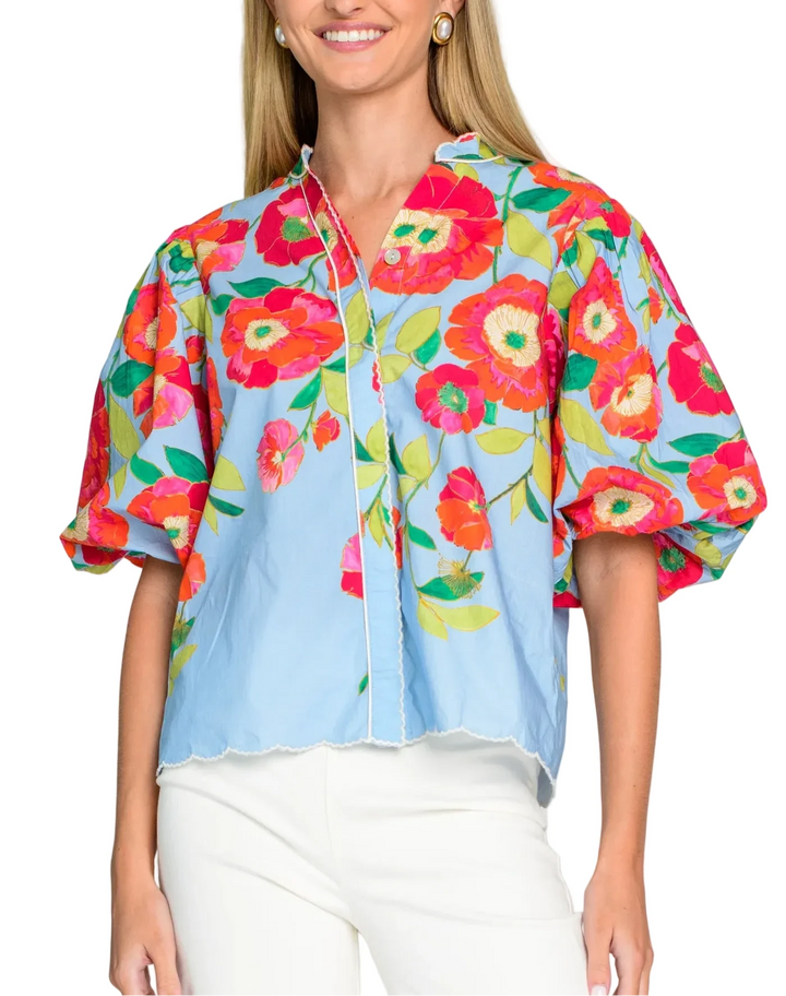 The button front Edie Top is one of our most adored styles and a basic that no wardrobe should be without. Featuring elastic cuff balloon sleeves and a covered placket, Edie looks great worn loose or tucked in with your favorite skirts, shorts or jeans.

 

Shown in Poppy Patch Blueberry

Complete the set! Pair with our matching Phoebe Skirt



Product Details

Cotton poplin
Mandarin collar
Button front
Covered placket
Balloon puff sleeves
Embroidery trim &amp; piping accents
