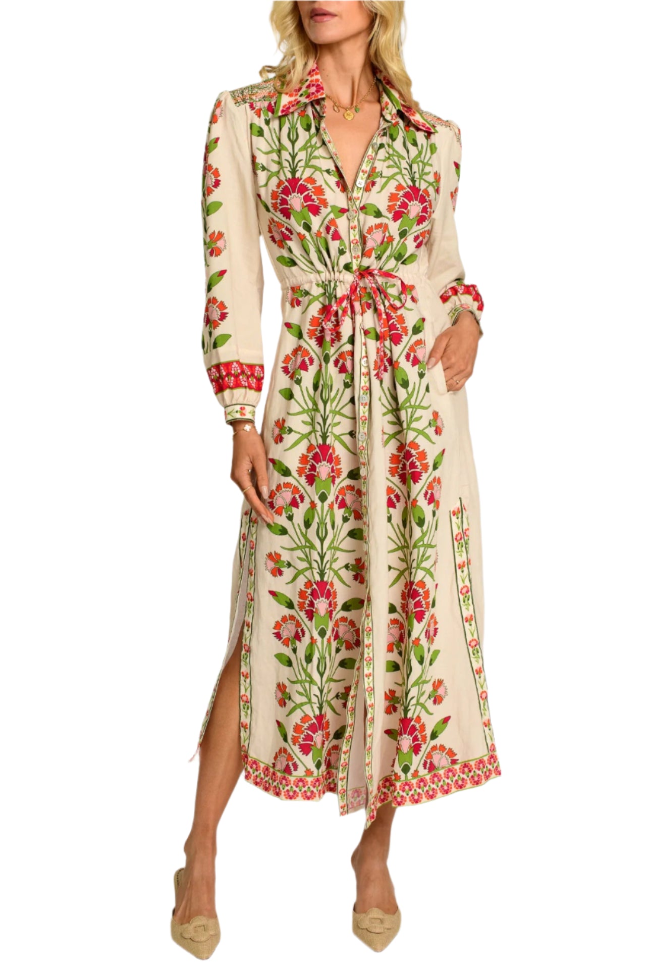 Lucia is intricately crafted from head to toe, featuring a collared neckline, colorful shoulder smocking, and side slits, all trimmed with a decorative border. Her drawstring waist makes her a comfortable, easy-wear style that can be dressed up or down.