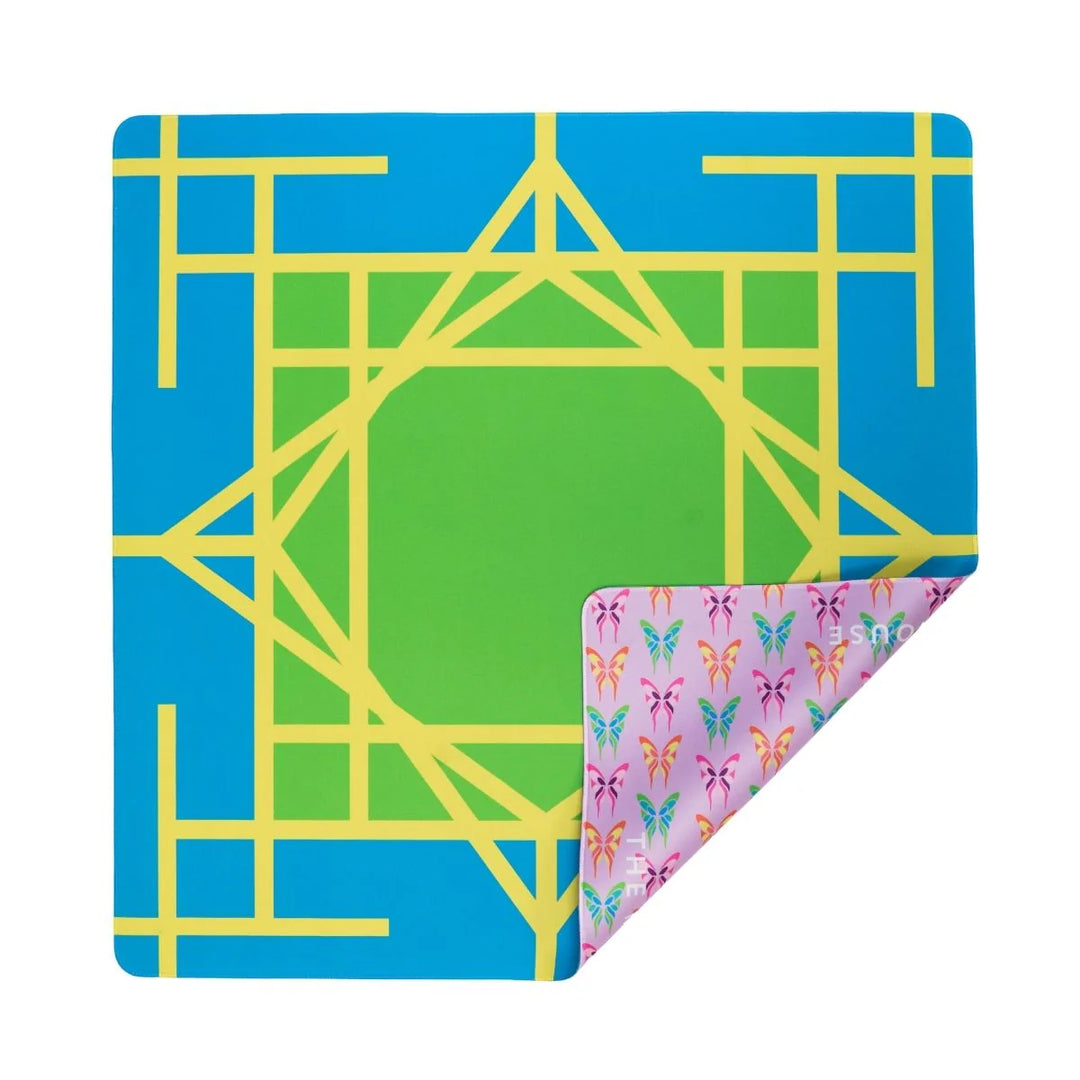 Bring twice the brightness to your game with our Electric Blue Garden Double-Sided Mahjong Mat. One side features a pattern of our signature colorful butterfly dragons and the other side a caning graphic created with our TMH initials. This mat creates a stunning backdrop, especially to our Brights! Electric Blue House Tiles, but is designed to mix-and-match with any tiles in the Brights House Collection, adding style and whimsy to every colorful game.