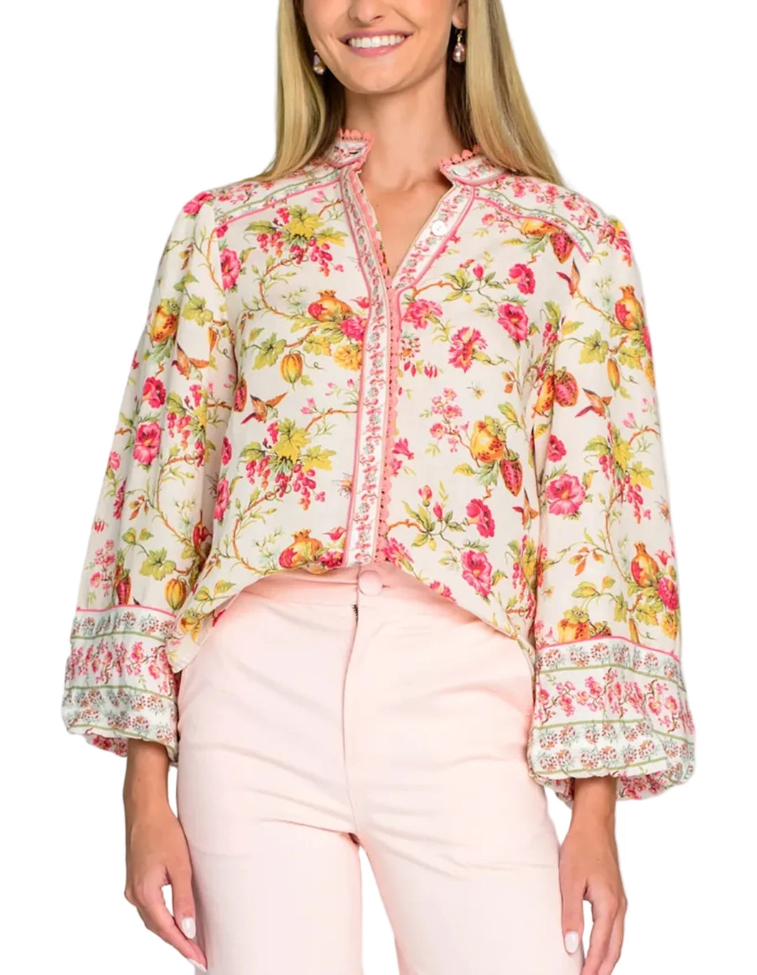 Cut from a light linen blend fabric, the Emily top in English Gardens is the perfect button front blouse to dress up or down this season. She features a mandarin collar, covered placket, and bubble hem sleeves, all adorned with decorative trim.