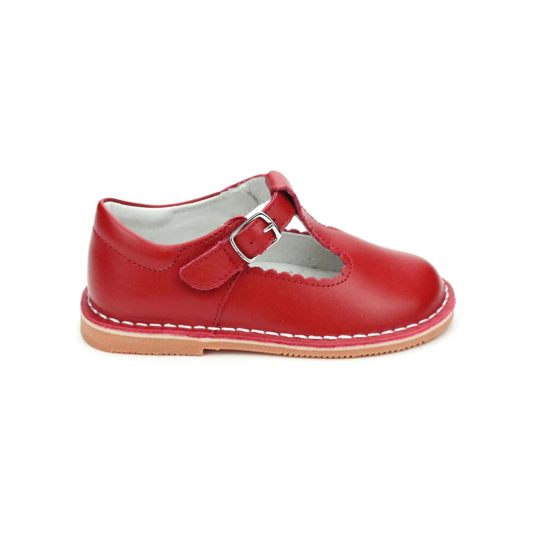 Selina is what we call an irresistibly pretty shoe. The scalloped detail on the t-strap is hard to miss. She&