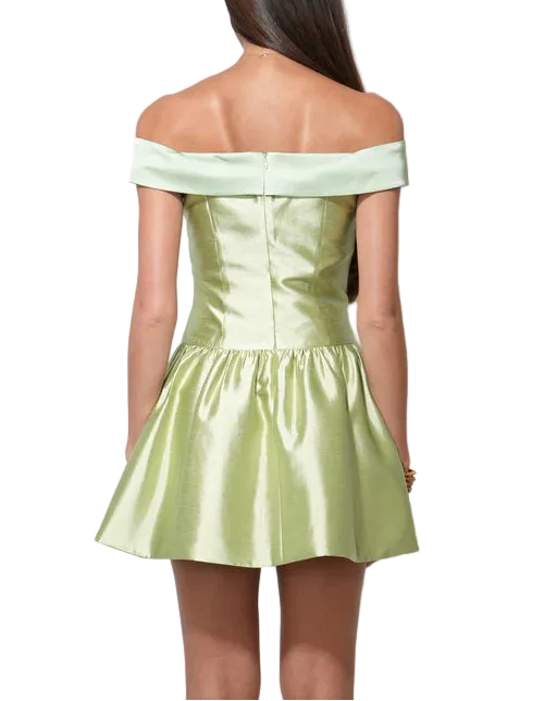 Featured in a bold Chartreuse color—a vivid, yellow-green shade—this dress is guaranteed to turn heads. Crafted from a luxurious satin fabric, the dress possesses a beautiful sheen and a fluid, party-ready drape.