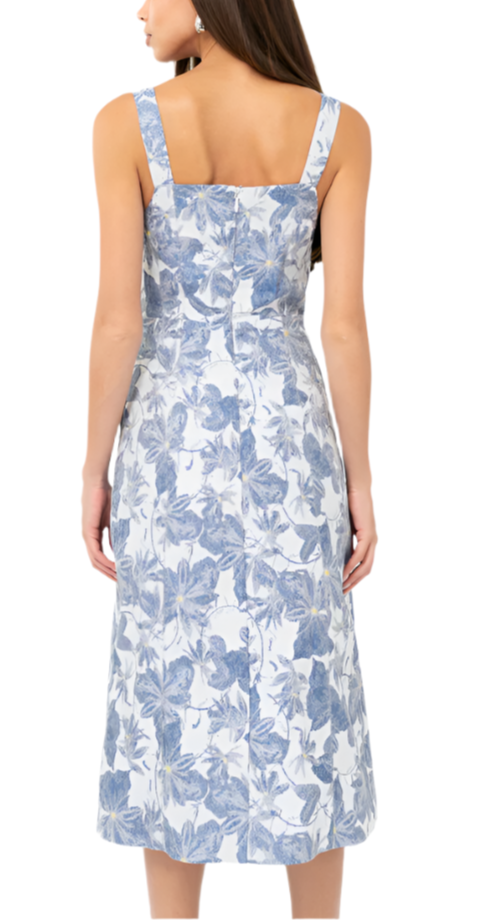 This strappy midi is imagined in a floral jacquard. The dress is installed with a square neckline and back zipper.