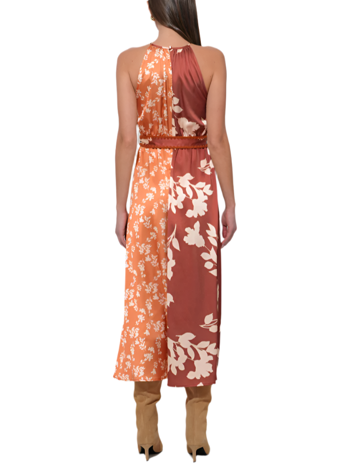 Turn heads in the Sandi Two Toned Halter Midi Dress, featuring a vibrant marigold and rich brown color combo. Its flattering halter neckline and midi length create a playful yet elegant silhouette perfect for sunny days or evening fun.
