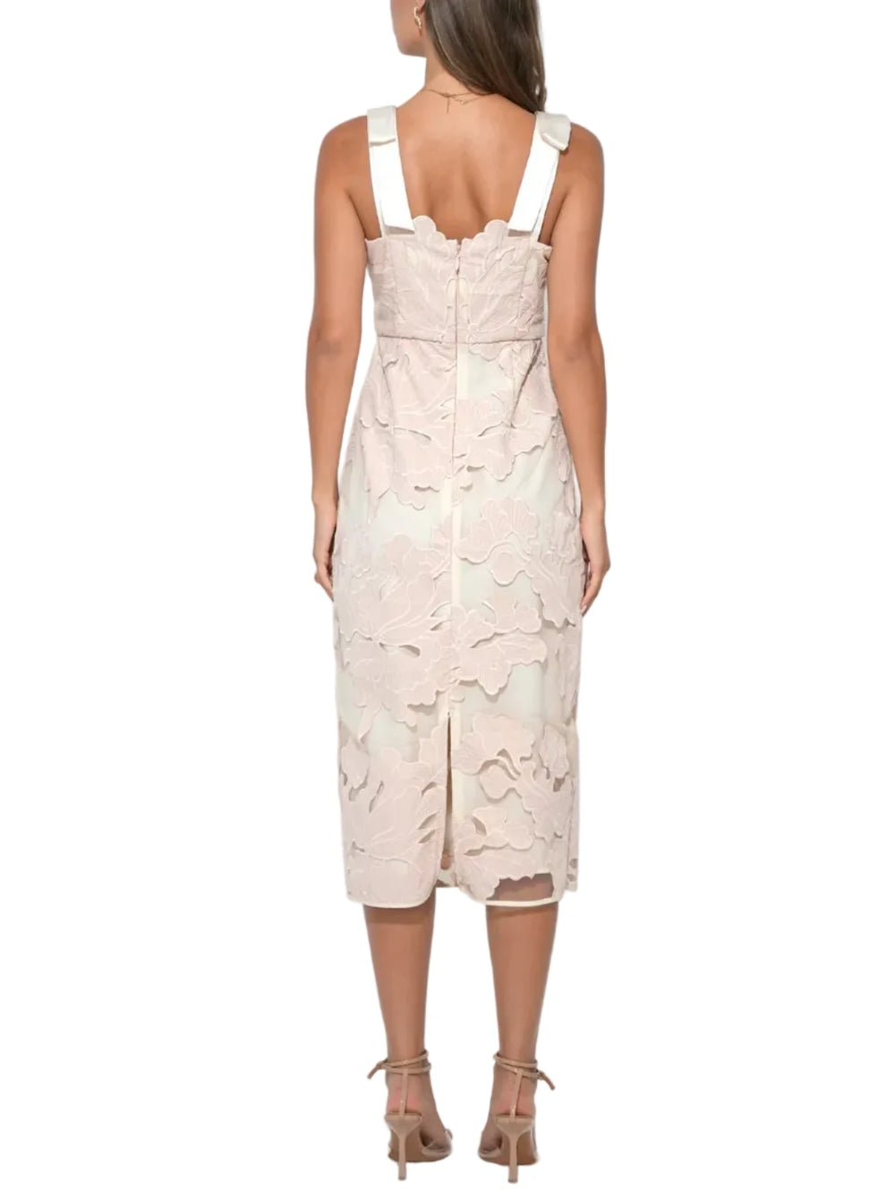 Typically crafted from a fluid, high-quality woven fabric with a subtle texture—like a soft crepe or a light satin—it drapes beautifully over the body, creating a movement-filled A-line silhouette. The warm cream base and soft blush pinks create a "candlelit" aesthetic that is incredibly flattering on various skin tones.
