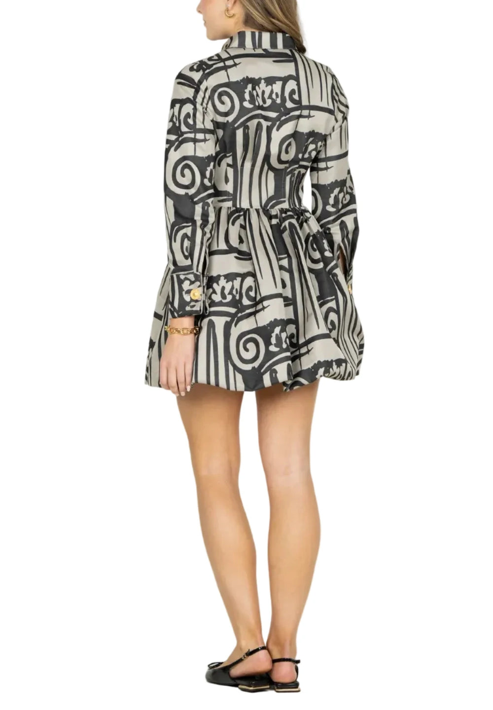 Woman wearing a patterned blazer on a white background