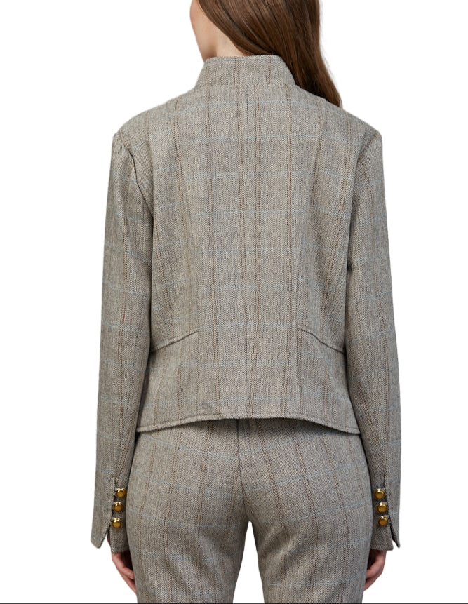 Step out in style with the Abbie Herringbone Pattern Jacket in Cream/Brown. This tailored jacket features a chic stand collar and a timeless herringbone design that adds a dash of sophistication to any outfit.