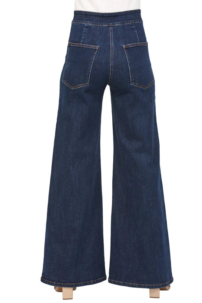 Effortless vintage-inspired style meets modern comfort in the Marcie Dark Denim High Waisted Wide Leg Jean. The high waist flatters your silhouette while the relaxed wide leg creates a timeless, sophisticated look. Crafted from quality dark denim, these jeans transition seamlessly from casual weekends to dressed-up evenings. Perfect for pairing with everything from fitted tops to oversized sweaters, the Marcie is a wardrobe essential that works as hard as you do.