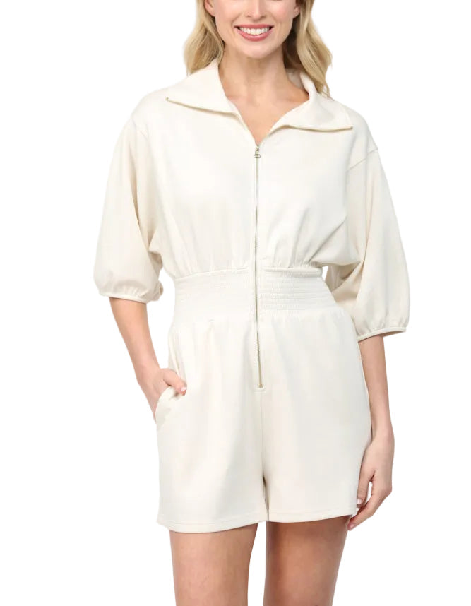 The Janet Romper is your go-to piece for effortless style and comfort. Featuring a full front zip closure for easy on-and-off dressing, this romper keeps things fun and functional. The smocked waist provides a flattering fit that moves with you, whether you're running errands or heading out for the day. Perfect for anyone who wants to look put-together without the fuss—one piece, endless possibilities!