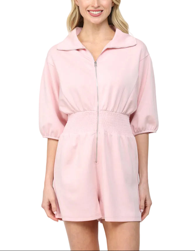 The Janet Romper is your go-to piece for effortless style and comfort. Featuring a full front zip closure for easy on-and-off dressing, this romper keeps things fun and functional. The smocked waist provides a flattering fit that moves with you, whether you're running errands or heading out for the day. Perfect for anyone who wants to look put-together without the fuss—one piece, endless possibilities!