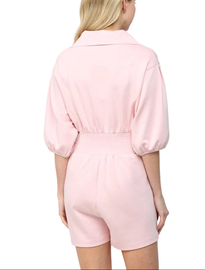 The Janet Romper is your go-to piece for effortless style and comfort. Featuring a full front zip closure for easy on-and-off dressing, this romper keeps things fun and functional. The smocked waist provides a flattering fit that moves with you, whether you&