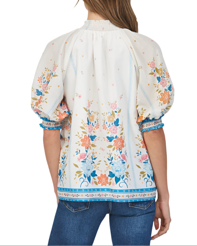 Introducing the Meg Cream Multi Smocked Blouse - the perfect addition to your wardrobe!
