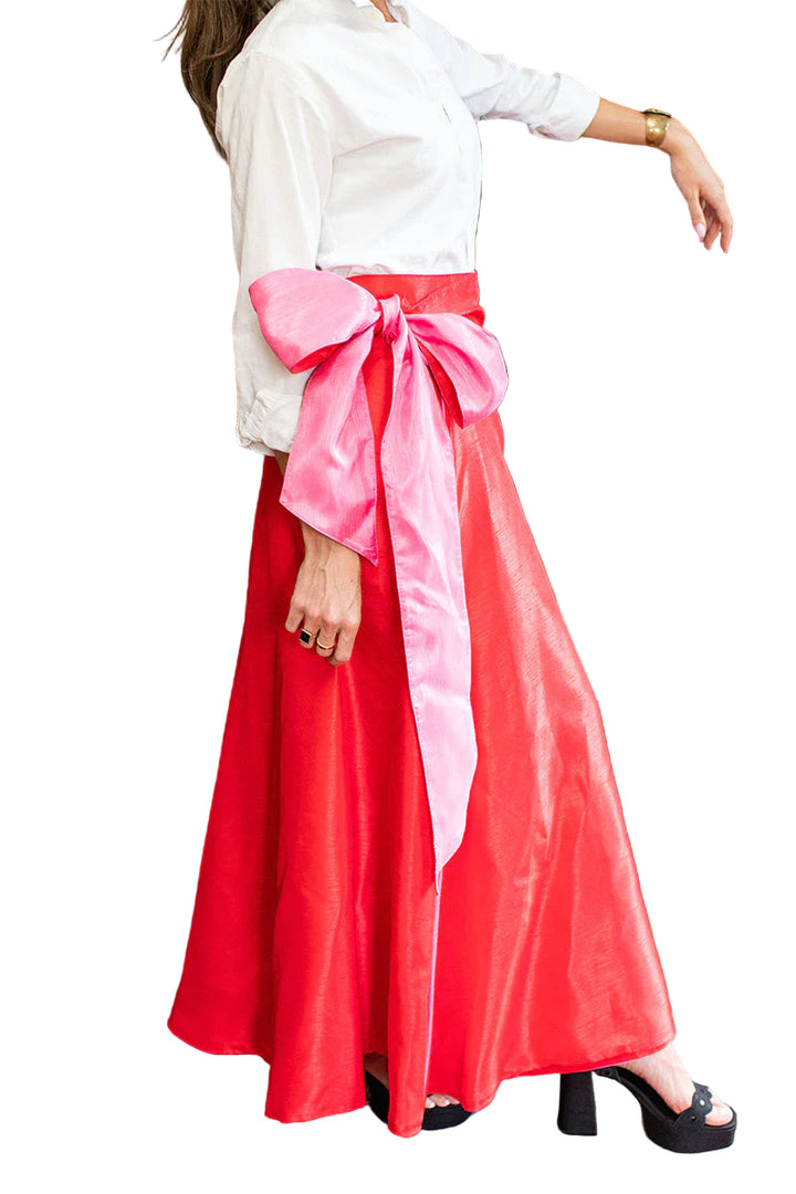 Meet our Perry Reversible Skirt. 
This vintage pink and ruby red reversible ball skirt is a statement in class and elegance.  The perfect staple to add to your wardrobe. 

Twirl into your next event in the most fabulous in this versatile piece that pairs perfectly with a simple white button down and beyond.  

With its wrap design and full length skirt, it is a nice adjustable fit that ties in the perfect bow at the waist.

Made of a beautiful poly shantung.

Handmade in the USA.

Poly blend shantung fabric