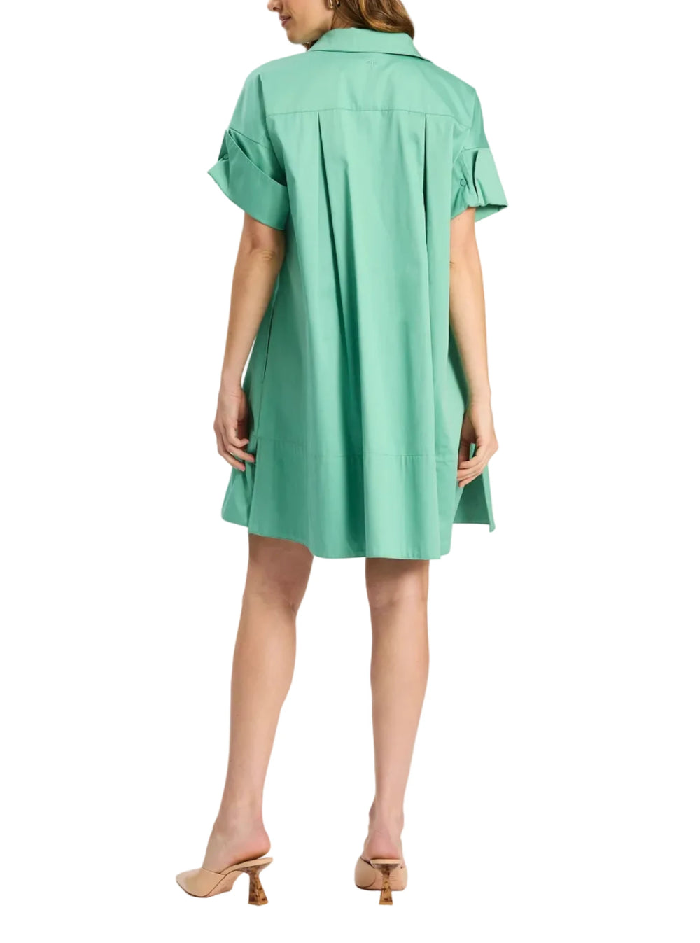 Woman wearing a green dress on a white background