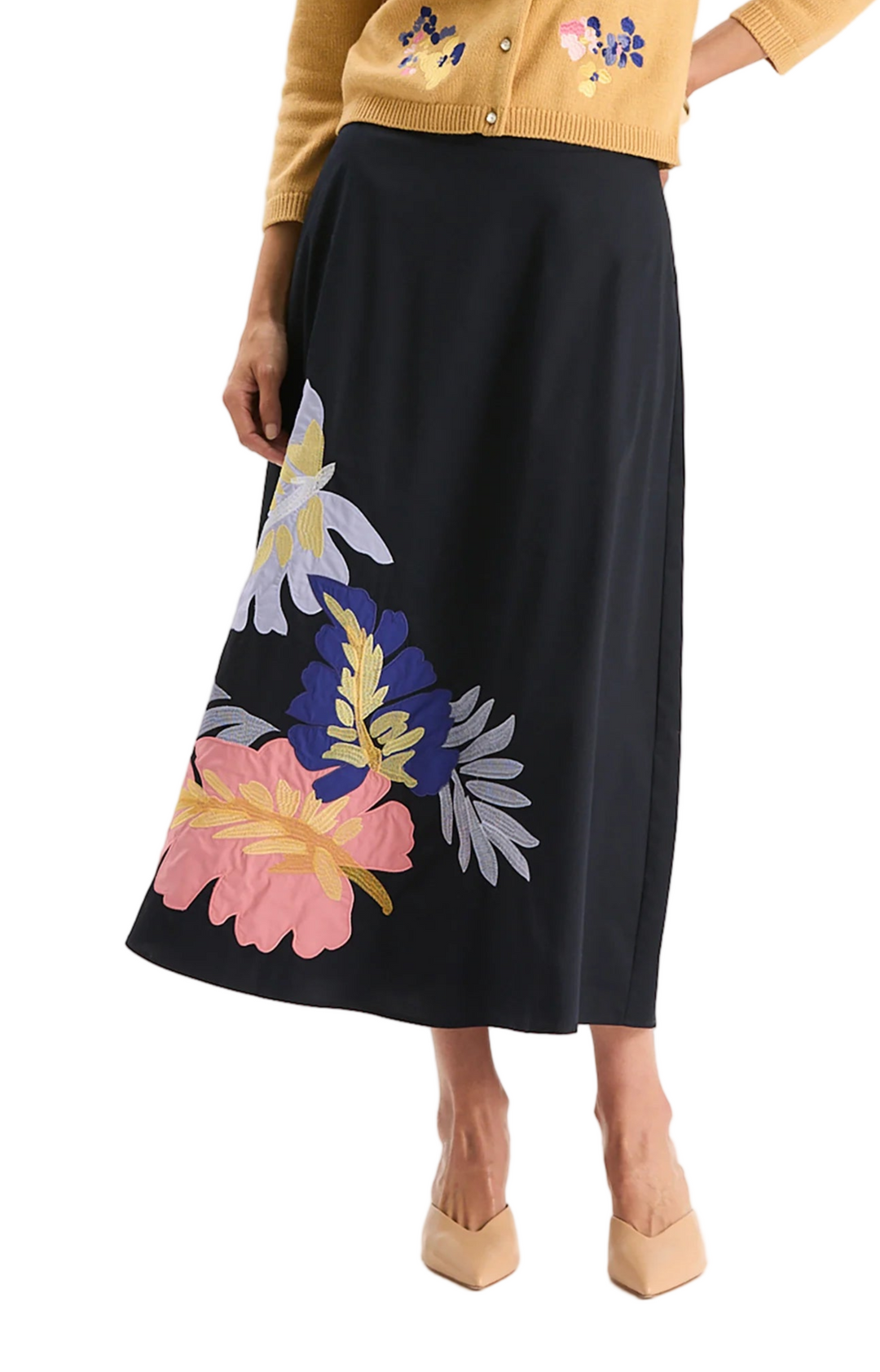 The Valentina Appliqué Skirt stands out with bold floral embroidery. The silhouette features a comfortable waistband, an A-line shape, and a flowing midi length for a graceful finish. Striking yet versatile, this piece moves effortlessly from day to evening and pairs beautifully with everything from knits to blouses.

Side zip closure
A-line silhouette
100% Cotton
Machine wash cold, lay flat to dry