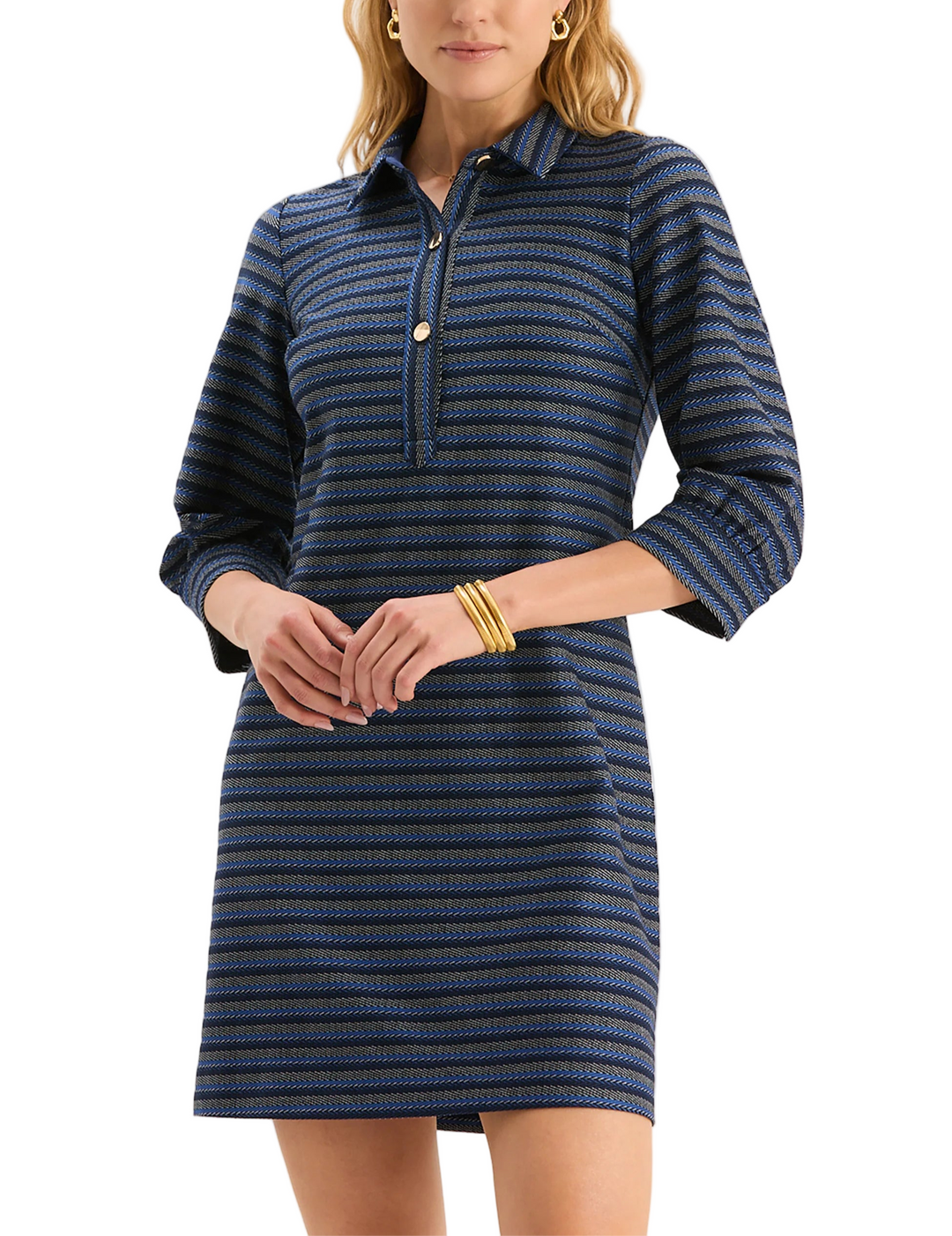 Meet Kat, the newest addition to our best-selling Knit Girls Collection! The Kat Knit Dress is crafted from a softly textured knit with subtle horizontal striping for added dimension. Designed with a structured collar, gold buttons, and three-quarter sleeves. Ideal for layering or wearing on its own, this versatile piece moves effortlessly from casual lunches to cozy evening plans.

Classic polo collar with gold button placket
Three-quarter length sleeves
70% Polyester, 25% Rayon, 5% Spandex 
Machine wash 