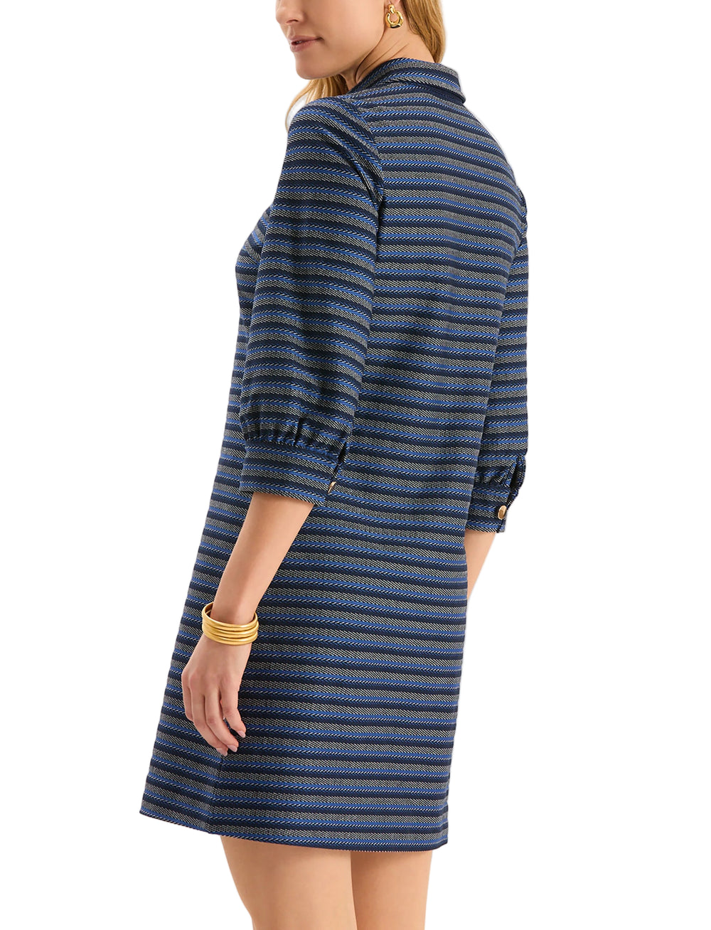 Meet Kat, the newest addition to our best-selling Knit Girls Collection! The Kat Knit Dress is crafted from a softly textured knit with subtle horizontal striping for added dimension. Designed with a structured collar, gold buttons, and three-quarter sleeves. Ideal for layering or wearing on its own, this versatile piece moves effortlessly from casual lunches to cozy evening plans.

Classic polo collar with gold button placket
Three-quarter length sleeves
70% Polyester, 25% Rayon, 5% Spandex 
Machine wash 