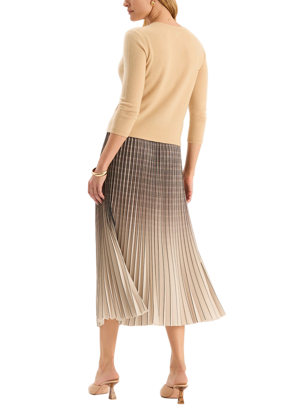 Designed in a classic plaid pattern, the Cara Pleated Skirt showcases gradient tones to create an ombré effect The design features pleats throughout, a chic midi length, and a flattering A-line silhouette that creates elegant movement with every step.

Elasticized waistband
Allover pleats
100% Polyester
Dry clean only