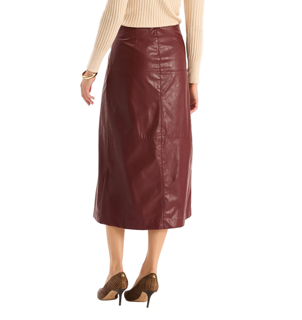 The Pheobe Vegan Leather Skirt has a luxurious feel with modern edge. This midi features a sleek, A-line silhouette with front slit detail that adds movement. Perfect with slim turtlenecks, silk blouses, or tailored jackets, it’s a versatile style that transitions seamlessly from day to night.

High-waisted silhouette
Front slit at bottom hem
Back zip closure
A-line silhouette
Shell: 100% Viscose, Coating: 100% Polyurethane
Lining: 100% Polyester
Turn inside out and machine was cold, hang dry