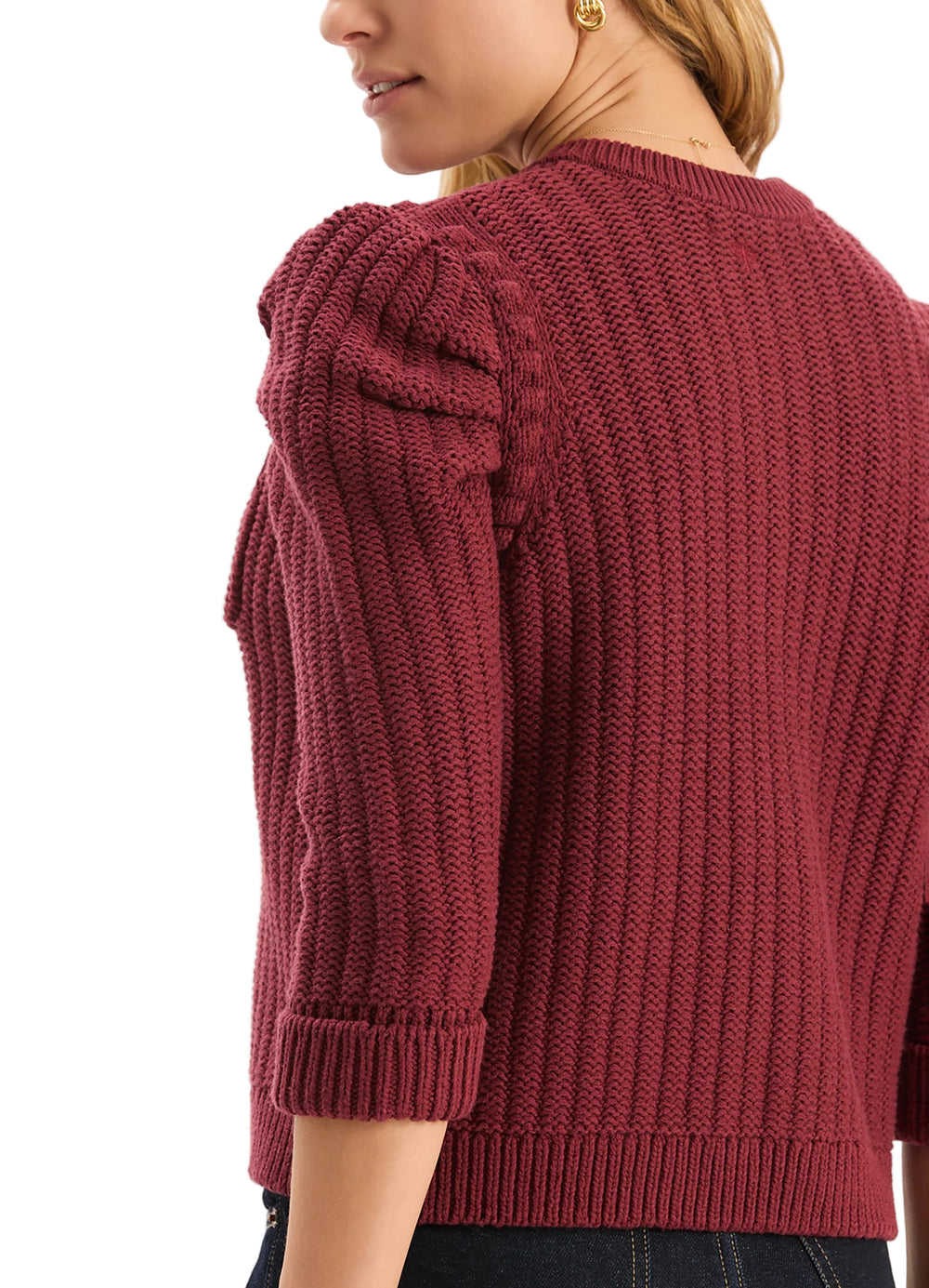 This cardigan can be worn like a little couture jacket that's revisited in knit. The cardigan has a slightly cropped shape, a round neckline and statement puffed shoulders. Elevated with gold buttons, this piece is easy to wear mid-season and layered as the weather gets colder.

Slightly puffed, three-quarter length sleeves
Front patch pockets
Front hook-and-eye closure
Gold button detail
59% Cotton, 38% Acrylic, 2% Nylon, 1% Spandex
Hand wash cold or dry clean