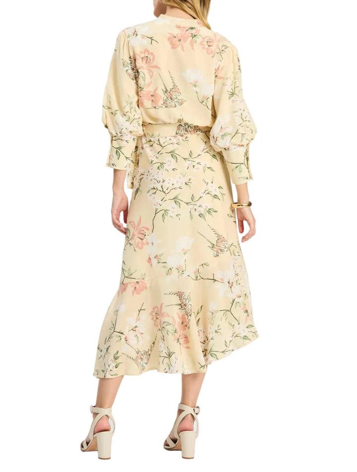 The Jules Silk Dress brings timeless femininity to the season with an elegant wrap silhouette and a delicate floral print. Crafted in luxurious silk, it features thoughtful details like button-cuff sleeves, a waist-defining sash tie, and a softly ruffled hem for graceful movement. Effortless yet elevated, it’s a standout piece for occasions that call for something polished, romantic, and unforgettable.

V-neckline
Three-quarter sleeves with button cuffs
Wrap-front silhouette with sash tie waist
Ruffled hem
