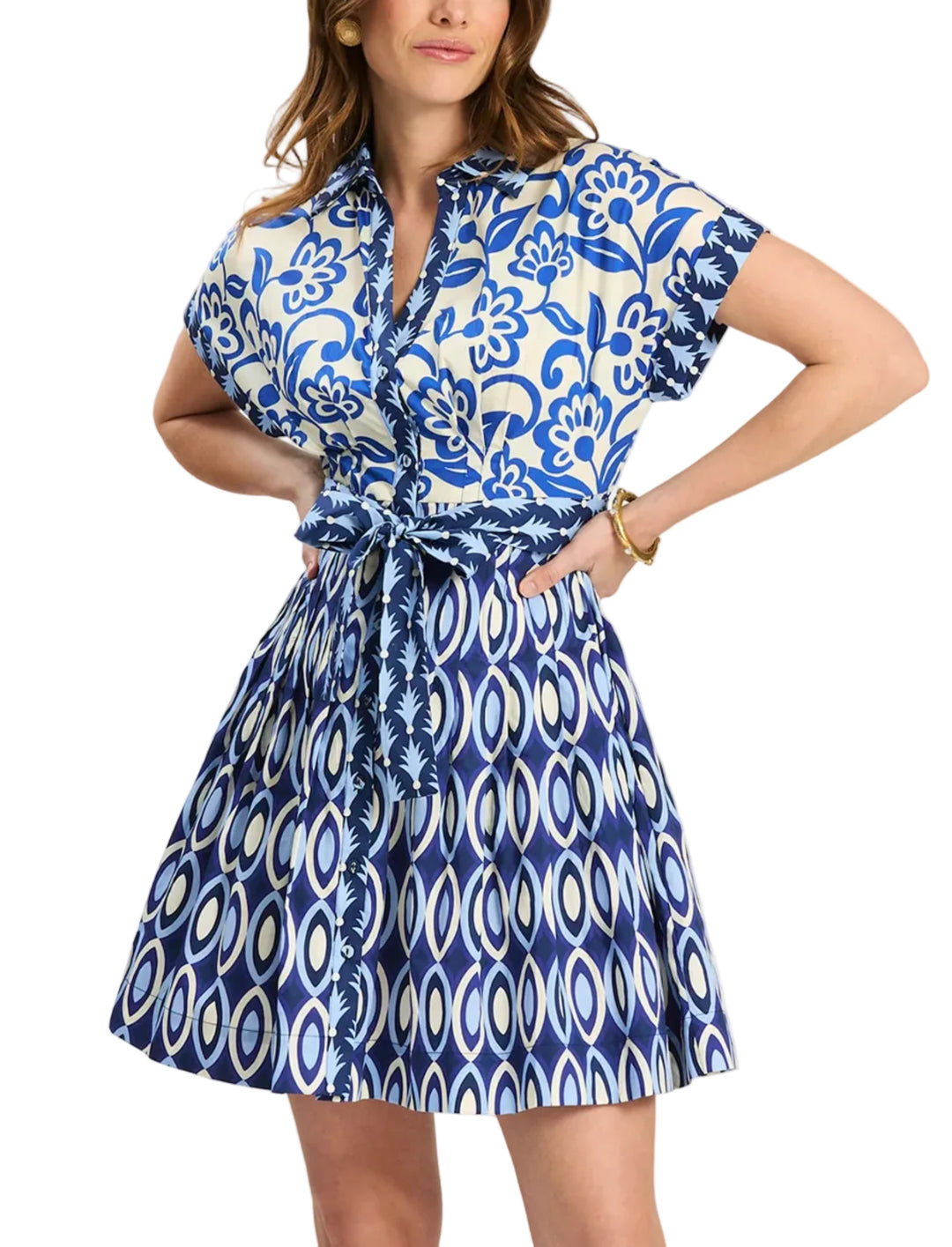 A playful yet polished warm-weather dress designed to stand out, the Hailey dress features a bold mixed blue print with a classic collar and easy button-front styling. Finished with a flattering tie-waist and functional pockets, this dress offers comfort without sacrificing style. Perfect for warm-weather events, weekends, and vacation days, it pairs beautifully with sandals or wedges for an elevated seasonal look.

Point collar
Button front
Cuffed cap sleeve
Pleated skirt
Self-tie belt
Side seam pockets
10