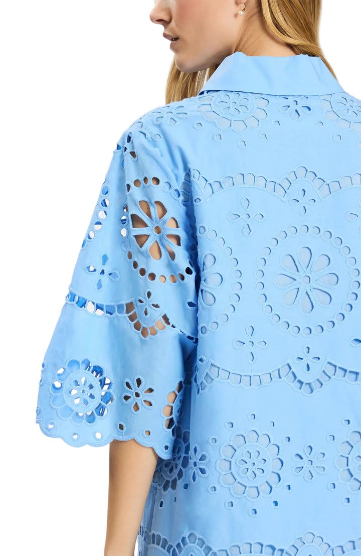An effortless statement dress for sunny days and warm nights. Crafted in beautifully detailed eyelet, this easy tunic silhouette features softly flared sleeves and a flattering neckline that feels both polished and comfortable. Perfect for everything from daytime plans to vacation dinners, it’s a throw-on-and-go favorite you’ll reach for all season long.

Point collar with front placket
Three-quarter sleeves with subtle flare
Allover eyelet design
100% Cotton
Machine wash cold, line dry