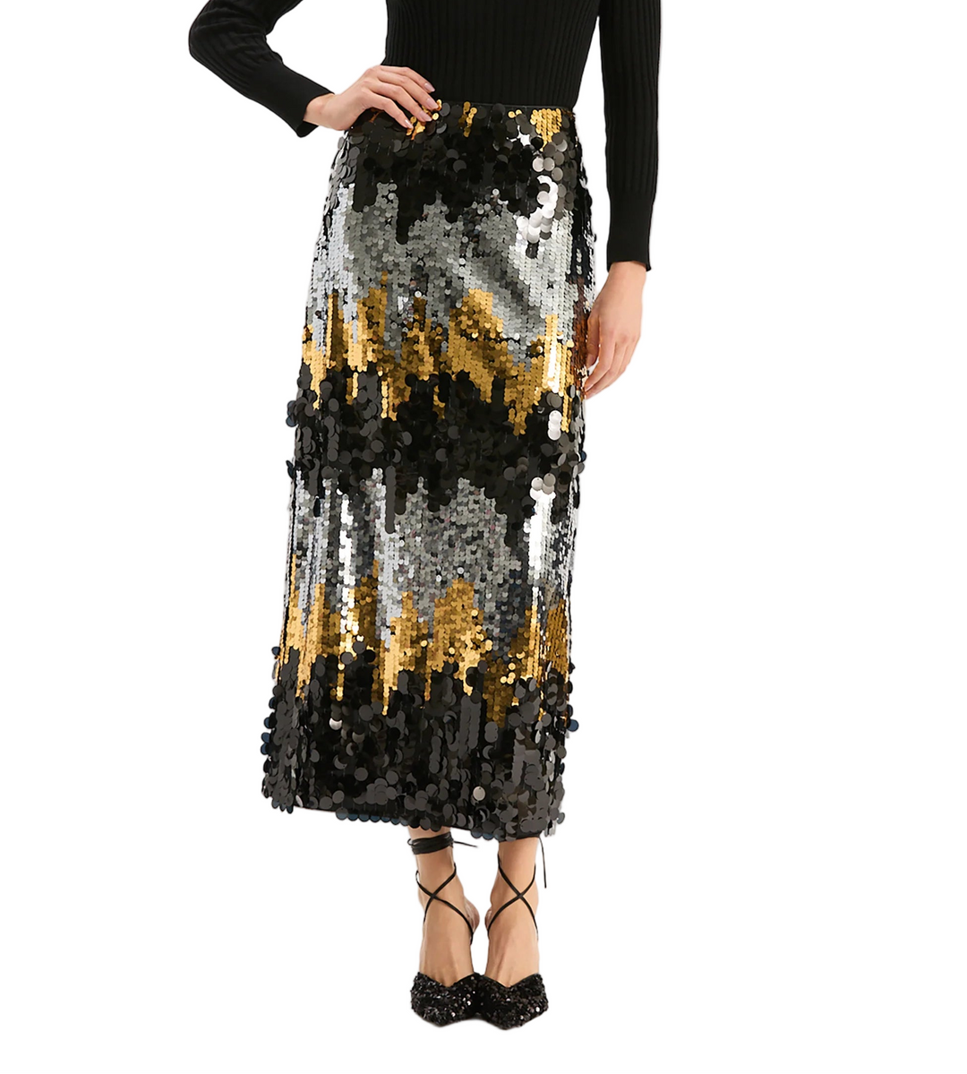 Sparkle and shine this season in the Collins Paillettes Skirt — a dazzling statement piece featuring bold sequins in a stunning ombré blend of gold, silver and black, creating a striking visual effect with every movement. The Collins offers a sleek, straight silhouette that flatters the figure while allowing fluid motion. The subtle shimmer and sophisticated pattern make it the perfect choice for festive soirées, galas, or nights out.

Midi length
Straight silhouette
Concealed side zipper closure
100% Polye
