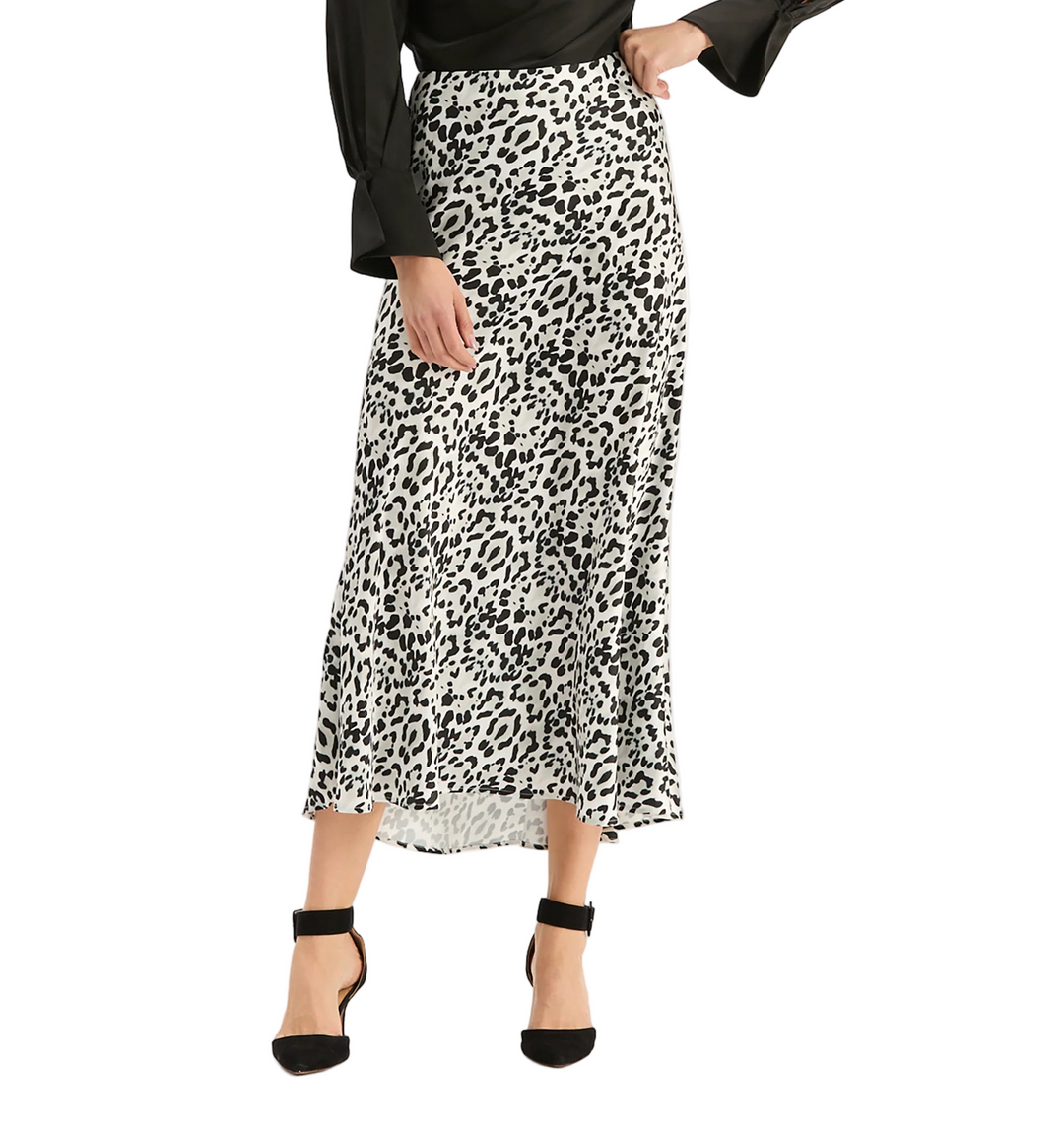 Sophisticated and endlessly versatile, the best-selling Edie Charmeuse Skirt is back. Crafted in a luxurious satin-charmeuse, this fluid skirt features a soft sheen and elegant drape that flatters the figure. Its high-waisted silhouette flows into a graceful A-line cut, creating the perfect balance of modern minimalism and timeless femininity. Style it with a silk blouse or knit turtleneck for an elevated look.

A-line silhouette
Side zip closure
100% Polyester
Dry clean only