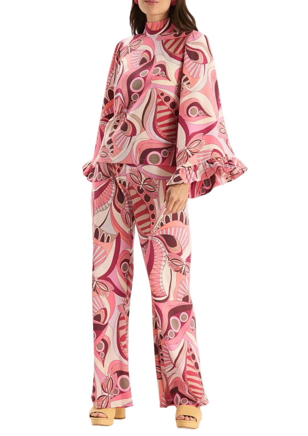 The Tess Tucci Knit Print Pant feel like a bold statement piece reimagined in a fluid, easy-to-wear silhouette. It features a high-rise waist, a wide-leg shape, and a vibrant retro-inspired print that brings instant energy to your look. Crafted from a soft, lightweight knit fabric, it moves beautifully and pairs effortlessly with everything from crisp shirts to cozy knits - add the Sarah Knit Tucci Capelet for a full set look! 

Elasticized waistband, pull-on style
High-rise silhouette
Wide leg
70% Acetate,