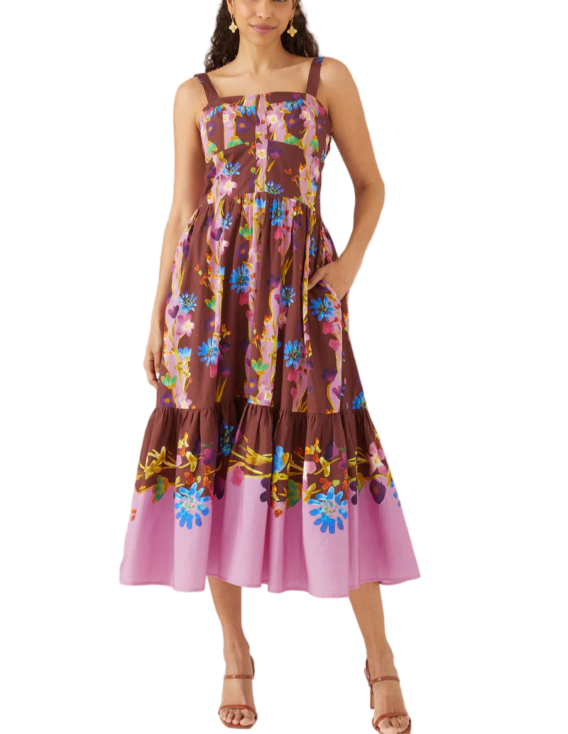 Introducing the Gianna Dress — featuring the most beautiful hand-painted floral print by the artisans at The Augusta Training Shop. With a corset-style bodice and smocked back, this dress flatters all figures. Plus, pockets for convenience. Perfect for all your Summer soirées!