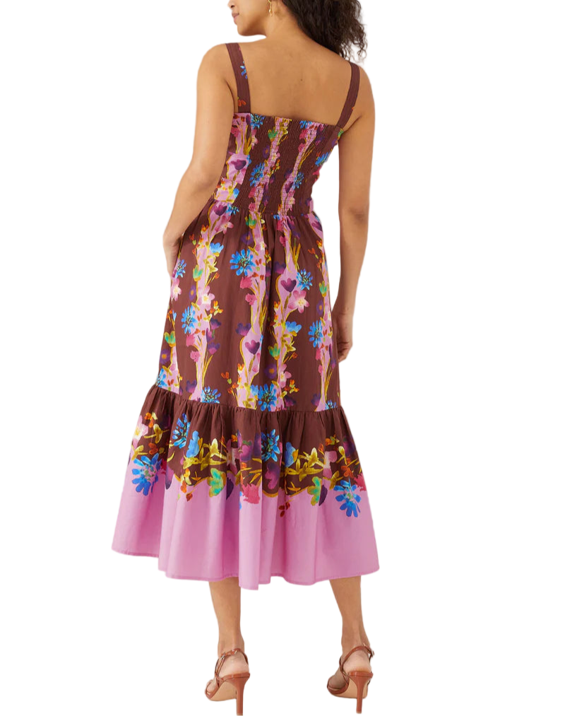 Introducing the Gianna Dress — featuring the most beautiful hand-painted floral print by the artisans at The Augusta Training Shop. With a corset-style bodice and smocked back, this dress flatters all figures. Plus, pockets for convenience. Perfect for all your Summer soirées!