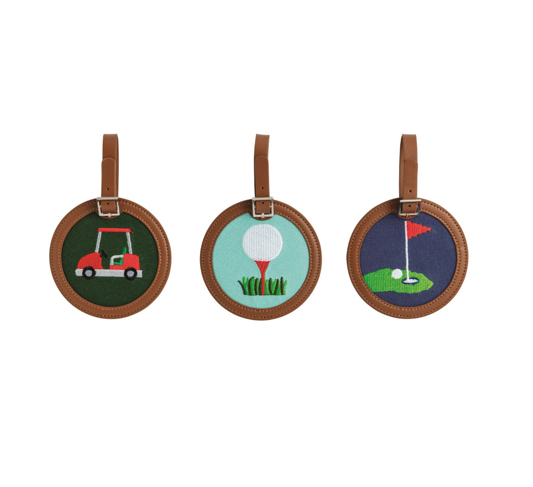Three round golf-themed bag tags on a white background