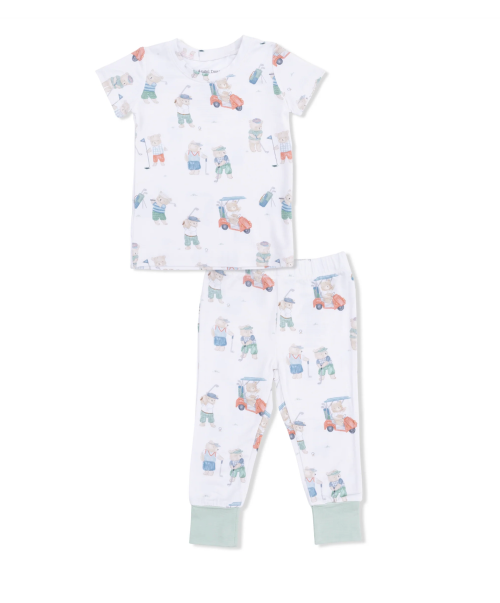Children's pajama set with golfing teddy bears pattern on a white background