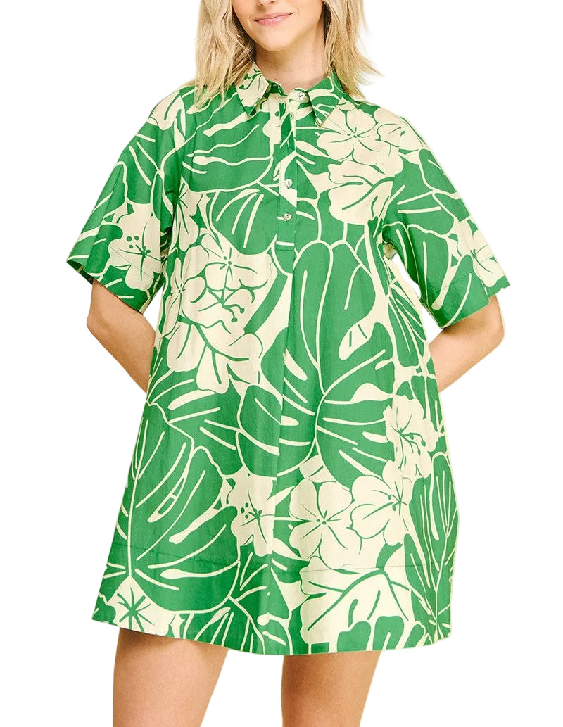 Woman wearing a green and white floral dress on a beige background
