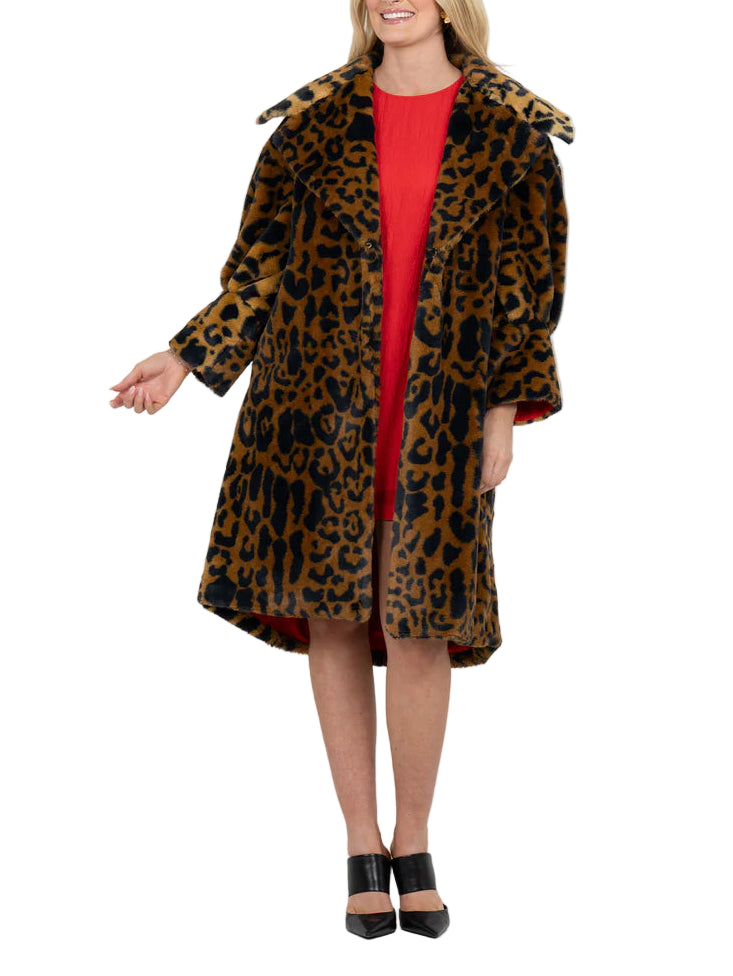 The Manhattan Coat in Lady Leopard is a true statement piece that balances cozy comfort with high-fashion drama. Designed in a plush leopard fur fabric, this coat makes an entrance with its bold oversized lapel, dramatic open cuffed sleeves, and classic hook-and-eye closure. The striking red lining offers an unexpected pop of color, adding even more personality to this head-turning style. A timeless layer that’s as warm as it is commanding, perfect for making a fierce impression this season and beyond.

Det