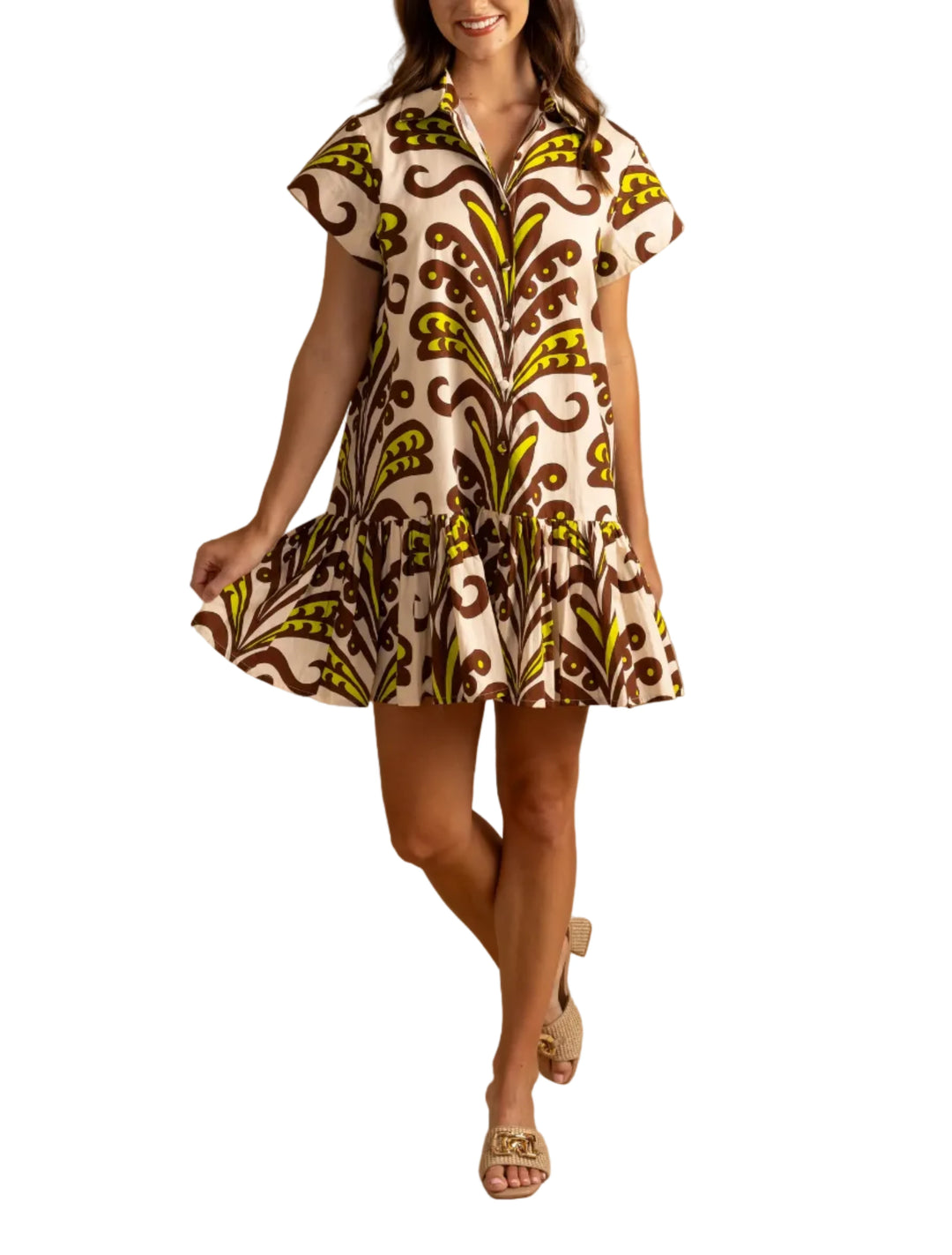 Playful yet polished, the Jenny dress by Double A brings an easy charm to everyday dressing. The crisp, breathable fabric gives it a light structure, while the relaxed fit, button-front detail, and flounced hem create effortless movement. Finished with a bold, artful print, it’s a standout piece that feels as fun as it looks.