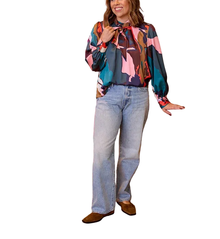Sophisticated with a playful twist, the Estelle Blouse is your answer to the perfect “jeans and a cute top” look. Featuring an optional neck tie and effortlessly flowy sleeves, this versatile style is a fall wardrobe staple.