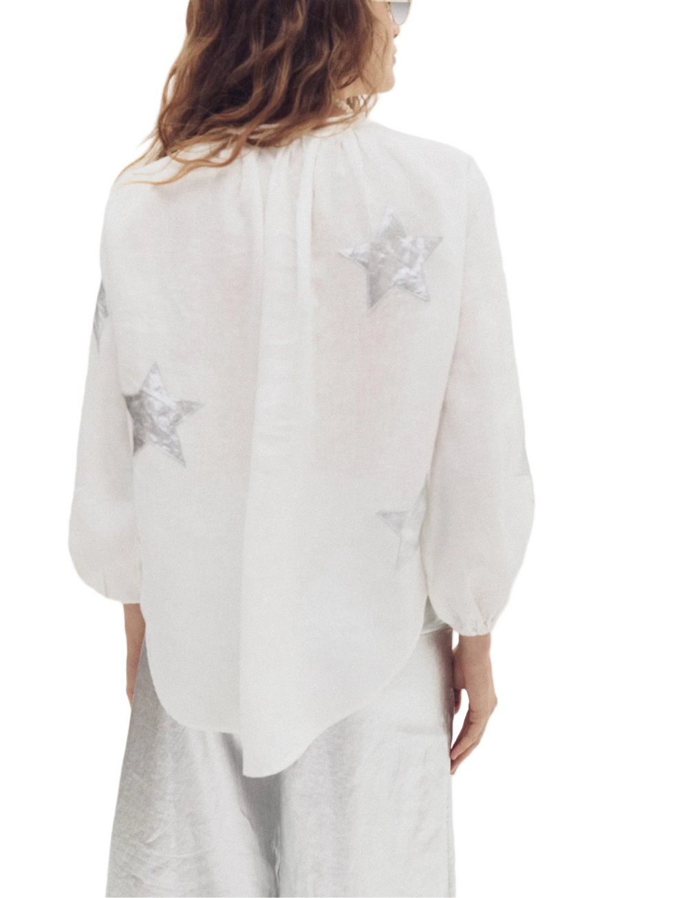 To fall in love with! The oversized shirt is super comfy and elegant, featuring a mandarin collar, a hidden button placket, and puffed long sleeves. 

Crafted with 100% linen fabric, it has heart-shaped foil pink appliques that add a feminine and super fun vibe to this style.

This style runs big. We recommend sizing down for the best fit.