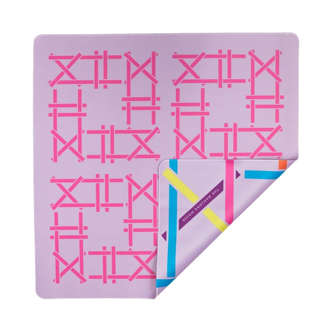 Bring twice the vibrance to your game with our Lilac Trellis Double-Sided Mahjong Mat. This fun, trellis-inspired design is an abstraction of the initials MH for Mahjong House. One side features a multi-colored pattern on a lilac backdrop and the other reflects the colors of the Lilac tile. This mat creates a stunning backdrop, especially to our Brights! Lilac House Tiles, but is designed to mix-and-match with any tiles in the Brights House Collection, adding an extra splash of color to every game.