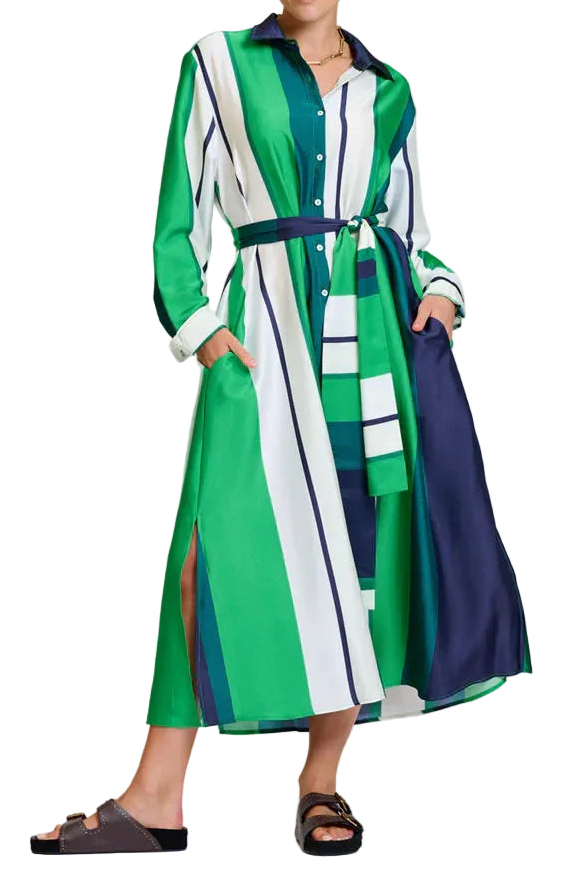 Woman wearing a colorful dress with a belt on a white background