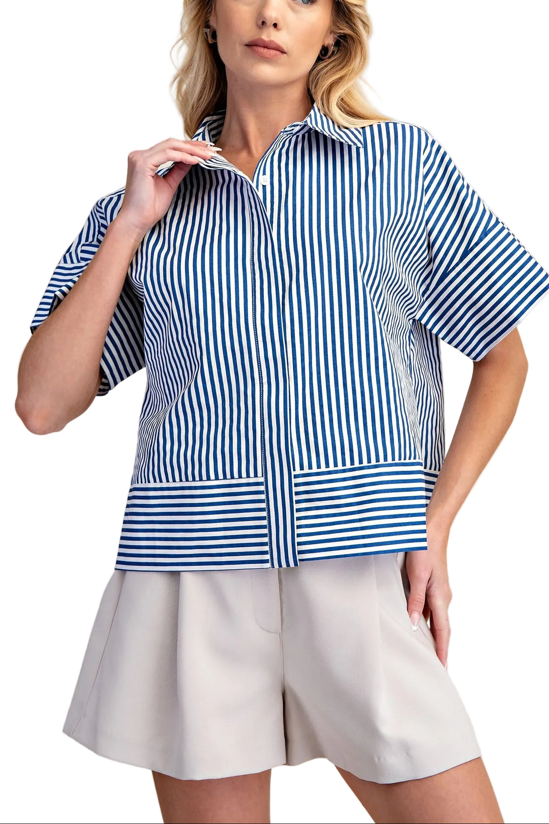 The Martha Blue Stripe Top combines classic style with everyday comfort. This neck band short sleeve button down features crisp blue stripes on a versatile base, perfect for layering or wearing solo. The structured neckline and button front closure offer a polished look, while the relaxed short sleeves keep you cool and comfortable. Ideal for casual outings, work settings, or weekend wear. A timeless piece that pairs effortlessly with jeans, skirts, or trousers.