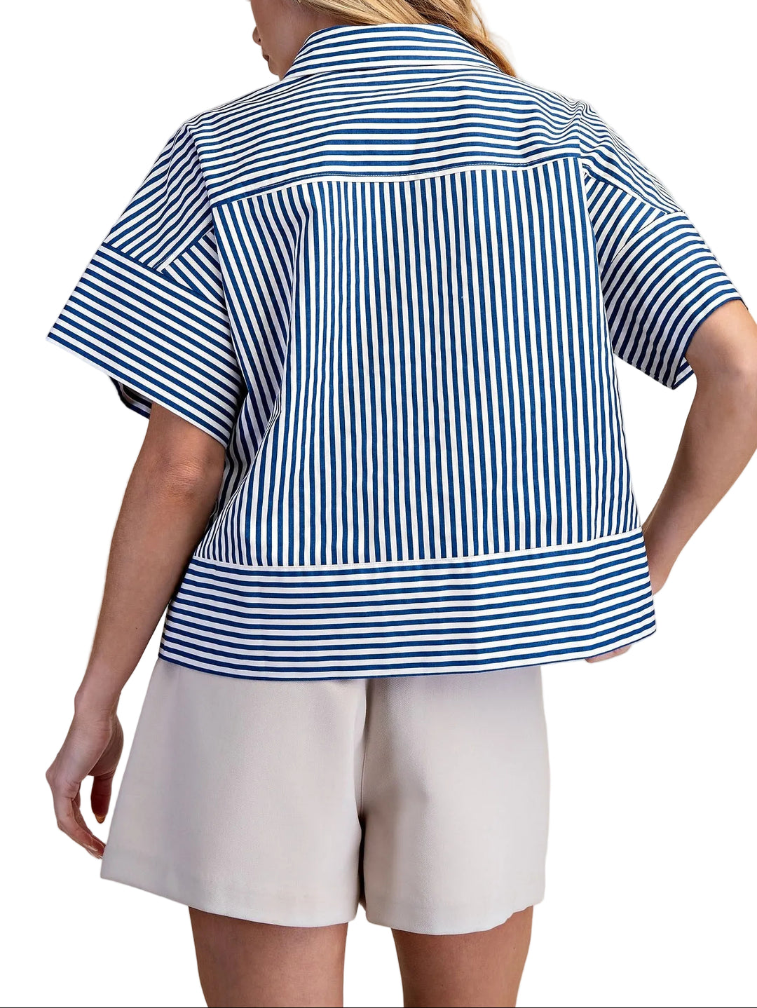 The Martha Blue Stripe Top combines classic style with everyday comfort. This neck band short sleeve button down features crisp blue stripes on a versatile base, perfect for layering or wearing solo. The structured neckline and button front closure offer a polished look, while the relaxed short sleeves keep you cool and comfortable. Ideal for casual outings, work settings, or weekend wear. A timeless piece that pairs effortlessly with jeans, skirts, or trousers.