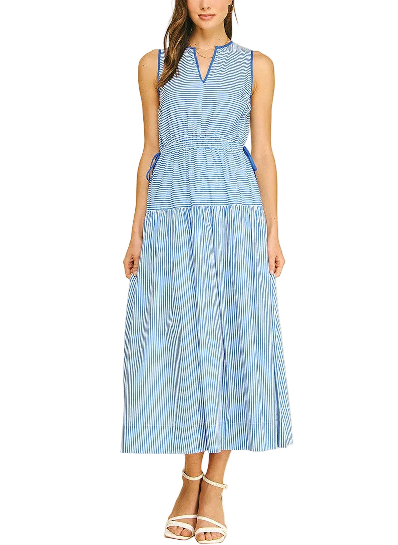 The Martha Striped Midi Dress combines timeless style with effortless versatility. This sleeveless V-neck design features classic stripes in a flattering midi length, perfect for layering or wearing solo. The relaxed silhouette works seamlessly from casual daytime looks to dressed-up evening occasions. Pair with sandals and a light cardigan for spring, or add heels and a blazer for a polished finish. A wardrobe essential that transitions beautifully across seasons.