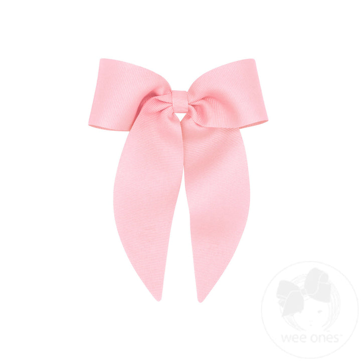 Large pink bow on a white background