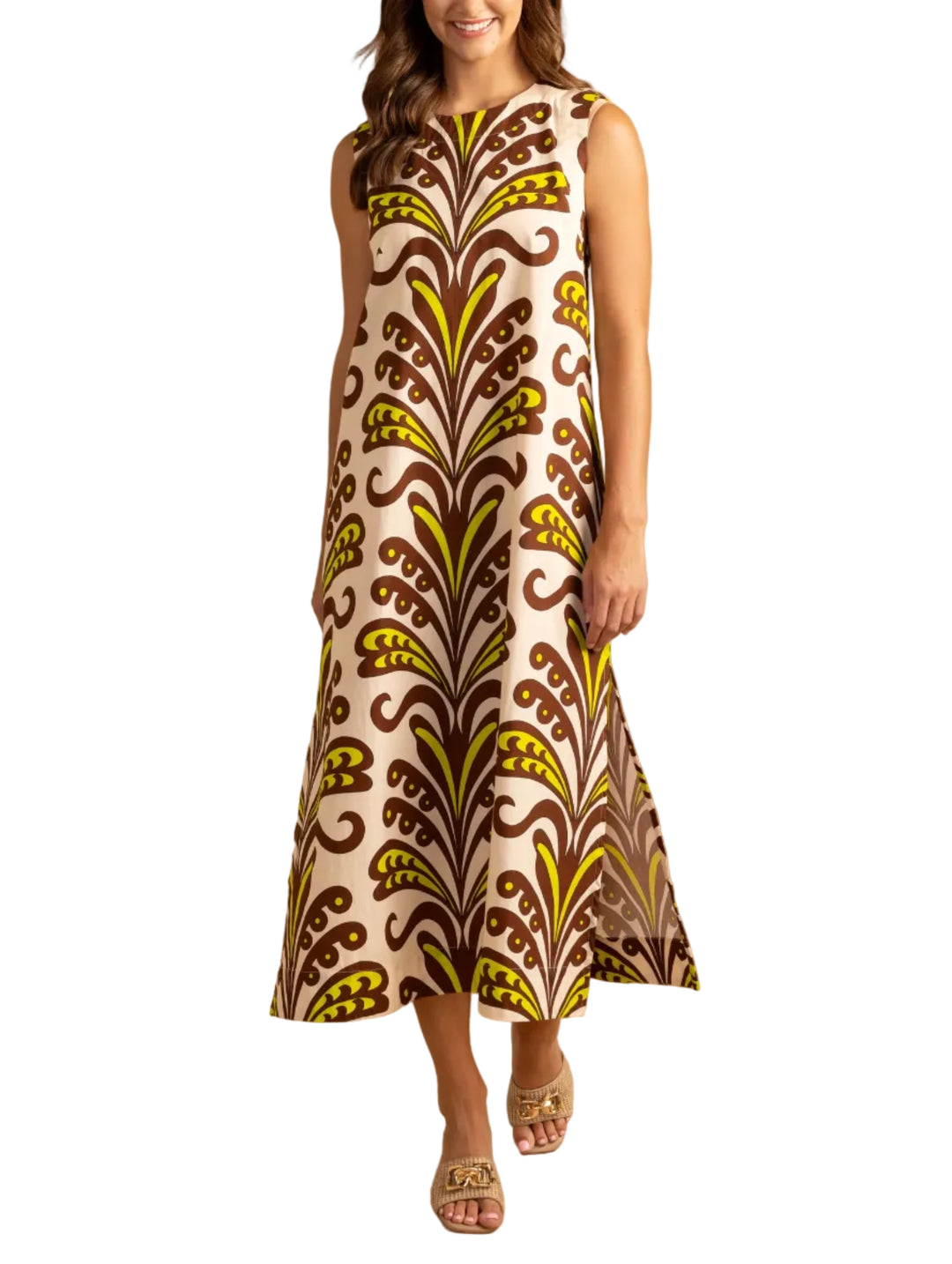 Woman wearing the Natasha Dress in Ornament by Double A, a sleeveless dress with a leaf pattern on a beige background