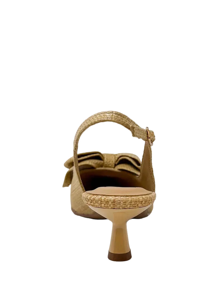 Elevate your everyday style with the Nora Slingback Heel, a refined yet relaxed silhouette designed to keep you on trend from day to night. Featuring a beautifully woven raffia-style texture in a warm natural tone, this pair brings an organic, elevated feel to any look. The soft pointed toe is complemented by a statement knot detail at the front, adding a touch of modern femininity. 